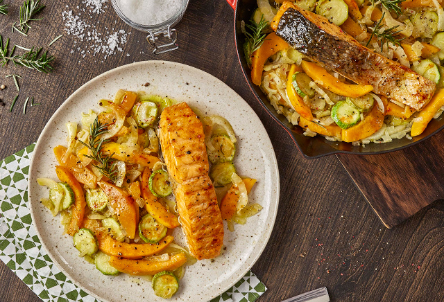 salmon fillet with vegetables in pan and oven